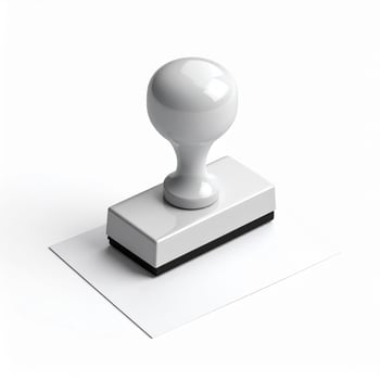 Applying a seal to an empty sheet of paper against a white backdrop photo