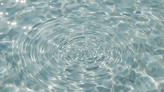 Close-up of water with splash ripple effects in the background photo