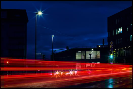 Dynamic Night Cityscape with Red Light Trails and Urban Glow photo