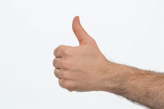 Caucasian Male Hand Giving Thumbs Up on White Background photo