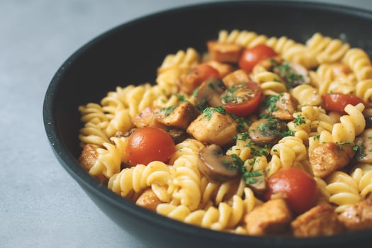 Chicken and Mushroom Pasta with Tomatoes in a Pan photo