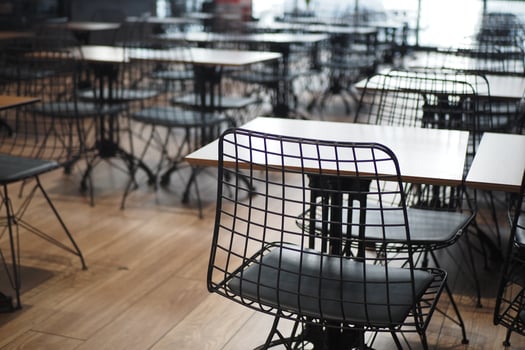 Modern cafe interior with empty tables and chairs photo