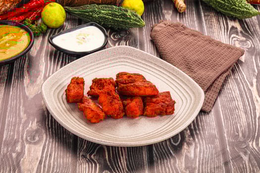 A plate of food on a table with a napkin and other items photo