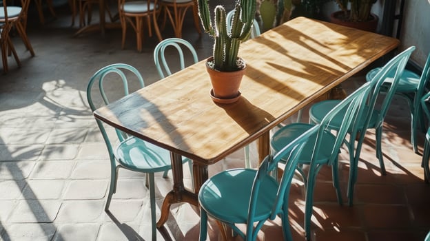 Sunny patio dining table with teal chairs photo
