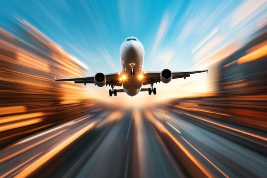 An airplane flying through the air with motion blur photo