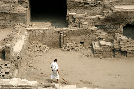 A man is walking through a building photo