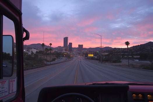 A view from the inside of a bus at sunset photo