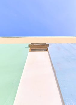 building wall with a clear blue sky in the background. Perfect for modern design themes with a fresh and airy atmosphere. photo
