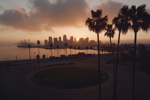 The sun sets over the city of los angeles photo