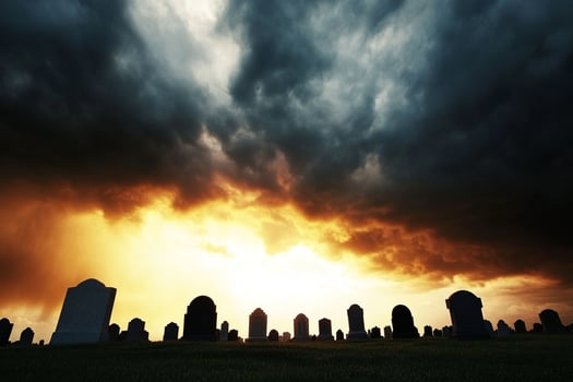 A cemetery with tombstones under a cloudy sky photo