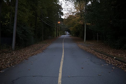 A street with a yellow line on it photo