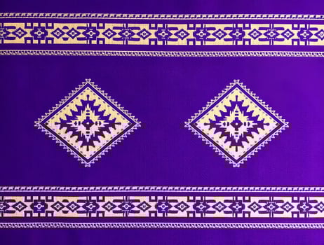 Vibrant Purple Textile with Geometric Design Ethnic Pattern Background photo