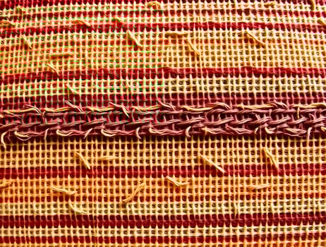 Striped Textile Texture Closeup of Woven Fabric with Red and Beige Pattern photo
