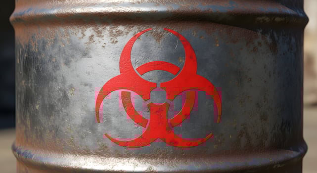 Rusty Metal Barrel with Biohazard Warning Sign in Outdoor Setting photo