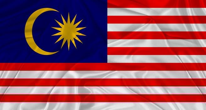 Flag of Malaysia with cloth texture. Close up of Malaysia flag waving photo