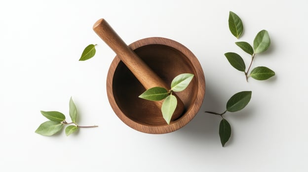 Mortar and leaves on white background photo