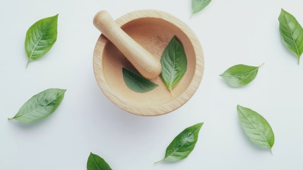 Wooden mortar and pestle with fresh basil leaves photo