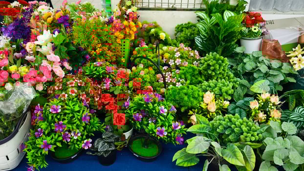 Vibrant Artificial Flowers and Green Plants Display for Home Decor and Retail photo