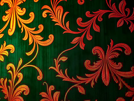 Intricate Orange Floral Design on Deep Green Fabric Elegant Textile Pattern for Design Inspiration photo
