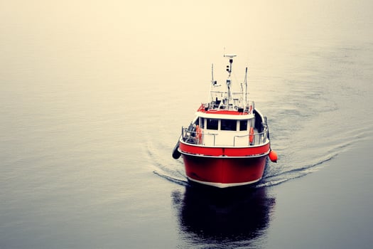 A boat is traveling on the water photo