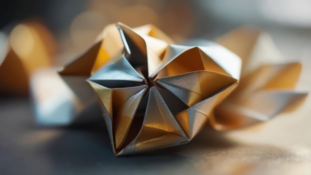 Close-up of intricately folded metallic paper sculpture photo