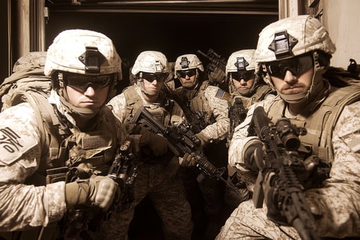 A group of soldiers standing in a doorway photo