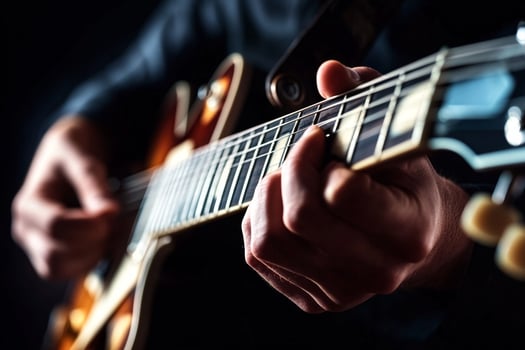 A person playing an electric guitar photo