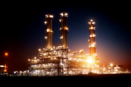 Oil refinery at night with lights on photo