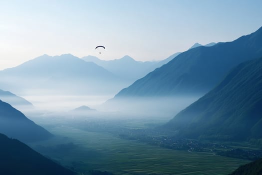 A person flying a kite in the mountains photo