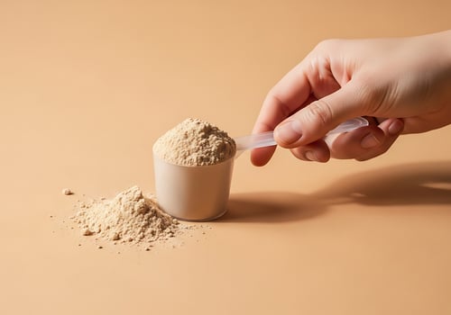 Hand scooping protein powder into a scoop for a healthy lifestyle and fitness supplement preparation photo