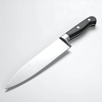 Sharp Stainless Steel Chef's Knife with Black Handle, Essential Kitchen Tool Isolated on a Clean White Background photo