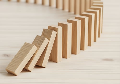 Falling Dominoes in Sequence - Chain Reaction of Teamwork photo