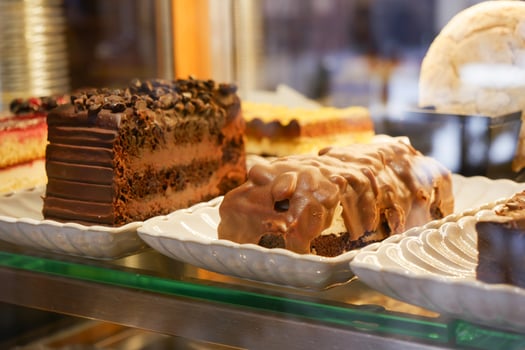 Delicious chocolate desserts displayed in a bakery showcase photo