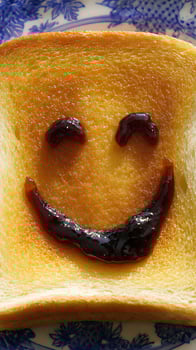 Smiley Face Toast with Jam A Delicious and Happy Breakfast Treat. photo