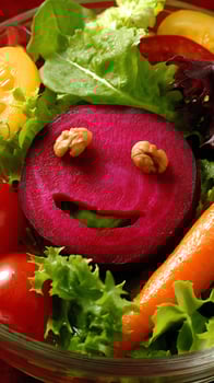 Happy Salad Face with Beet, Walnuts, and Fresh Greens. photo