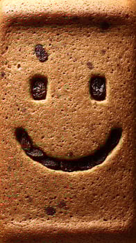 Delicious Raisin Bread Baked With A Happy Smiley Face. photo