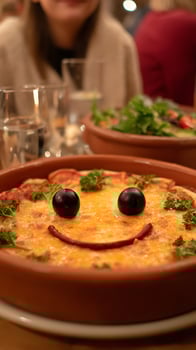 Smiling Pizza and Salad Dinner with Friends at Cozy Restaurant. photo