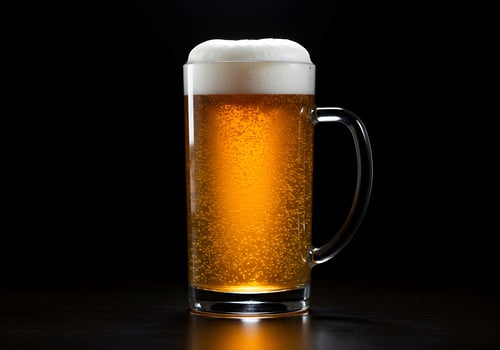 Glass mug with fresh cold beer on black background. photo