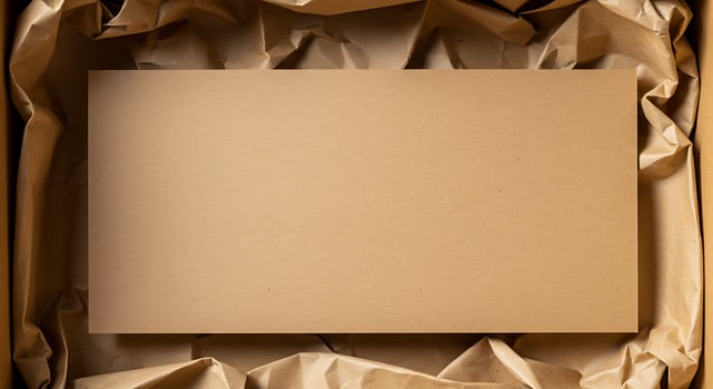 Blank Brown Cardboard Sign in Crumpled Paper Packaging for Shipping or Advertising photo