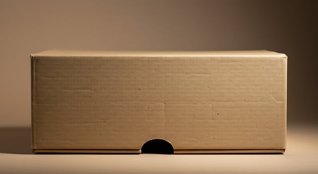 Plain Cardboard Box with Rounded Cutout on Neutral Background photo