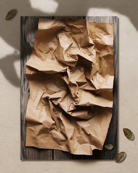 Crumpled Brown Paper Texture on Dark Wood Plank with Leaves kraft paper photo