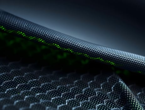 Closeup of Textured Fabric with Green Luminescent Stitching Abstract Design photo