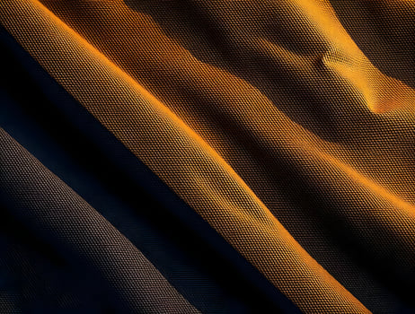 Textured Fabric Background Abstract Dark and Amber Hues Draped Material photo