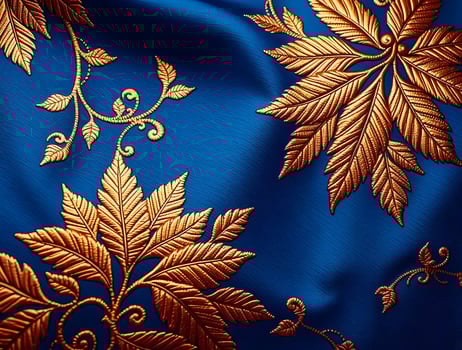 Luxurious Gold Leaf Embroidered Blue Textile CloseUp Detail of Elegant Fabric photo