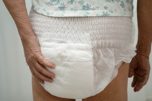 Asian senior woman patient wearing adult incontinence diaper pad photo