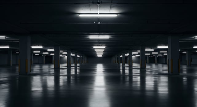 An empty parking garage with lights on photo