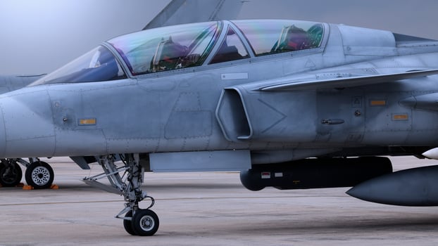 Close up of modern aircraft military fighter jet. Close up Jet parts such as landing gear engine nacelles weapon pods and cockpit with visible pilots showing defense technology and aircraft design, photo