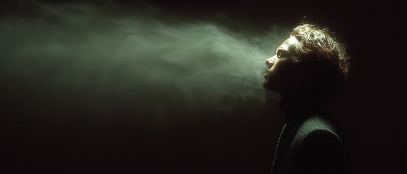 Smoke rising from a persons head photo