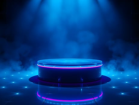 A blue stage with a spotlight and a spotlight photo