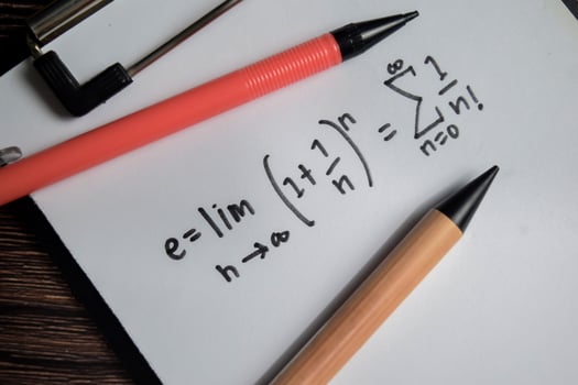 Concept of definition of the Euler's number write on book isolated on Wooden Table. photo